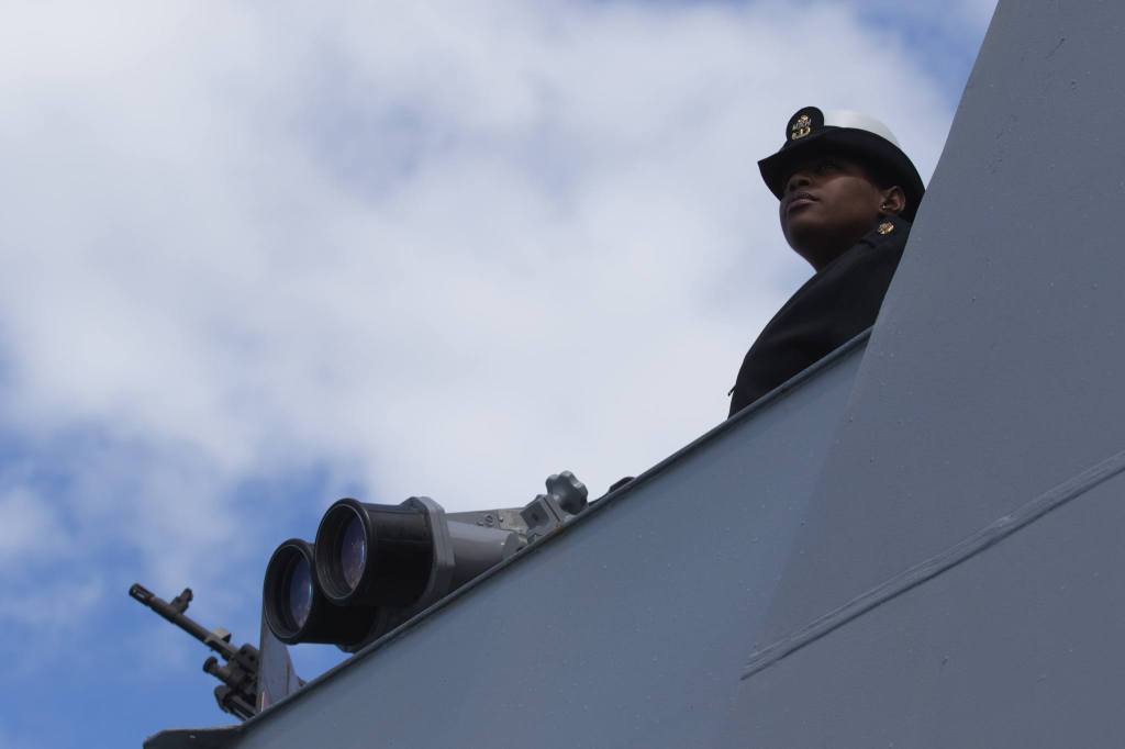 Chief Petty Officer Brandee Sandoval looks out as the USS Gridley pulls into port at Seattle. (Andy Bronson / The Herald)