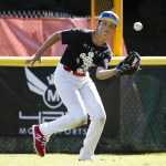 Pacific Little League All-Star team member Kam Jordan chases down a fly ball during a practice at Lynndale Park in Lynnwood on Tuesday. (Ian Terry / The Herald)