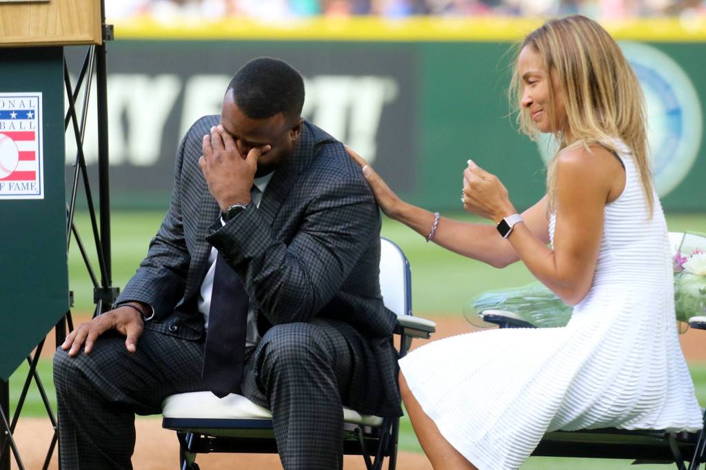 Ken Griffey Jr. with his wife Melissa Griffey during a number retirement ceremony Saturday at Safeco Field. (Kevin Clark / The Herald)