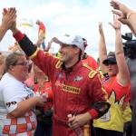 Andrew Tate is congratulated after winning the H1 Unlimited Heat of the Seafair hydroplane races Sunday in Seattle. (Kevin Clark / The Daily Herald)