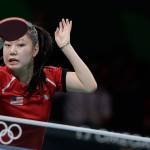 Lily Zhang of the United States competes against Jieni Shao of Portugal during their table tennis match at the 2016 Summer Olympics in Rio de Janeiro, Brazil on Saturday. (AP Photo/Petros Giannakouris)