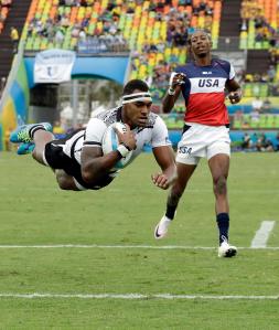 Fiji&rsquo;s Semi Kunatani scores a try as THE United States&rsquo;s Perry Baker watches during the men&rsquo;s rugby sevens match at the Summer Olympics in Rio de Janeiro, Brazil on Wednesday. (AP Photo/Themba Hadebe)