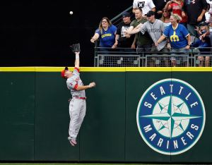 Angels center fielder Mike Trout robs the Mariners&rsquo; Leonys Martin of a grand slam in last Sunday&rsquo;s game in Seattle. (AP Photo/Elaine Thompson)