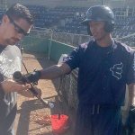 Everett AquaSox outfielder Dimas Ojeda (right) speaks with Viper Bats representative Chris Fine before Monday&rsquo;s game at Everett Memorial Stadium. (Jesse Geleynse Photo)