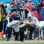Seahawks cornerback DeShawn Shead (35) runs past Panthers linebacker Ben Jacobs (53) on a fake punt during the second half of a divisional playoff game on Jan. 17 in Charlotte, N.C. Shead gained 17 yards and a first down on the play. (AP Photo/Chuck Burton)