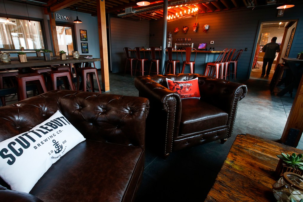 Scuttlebutt Brewing Company&rsquo;s new taproom at their Cedar Street brewery location in Everett will feature ten rotating taps, crowlers and growlers, as well as seating with a full view of brewing operations. (Ian Terry / The Herald)