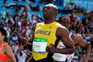 Jamaican sprinter Bolt cruises into 100 semifinals