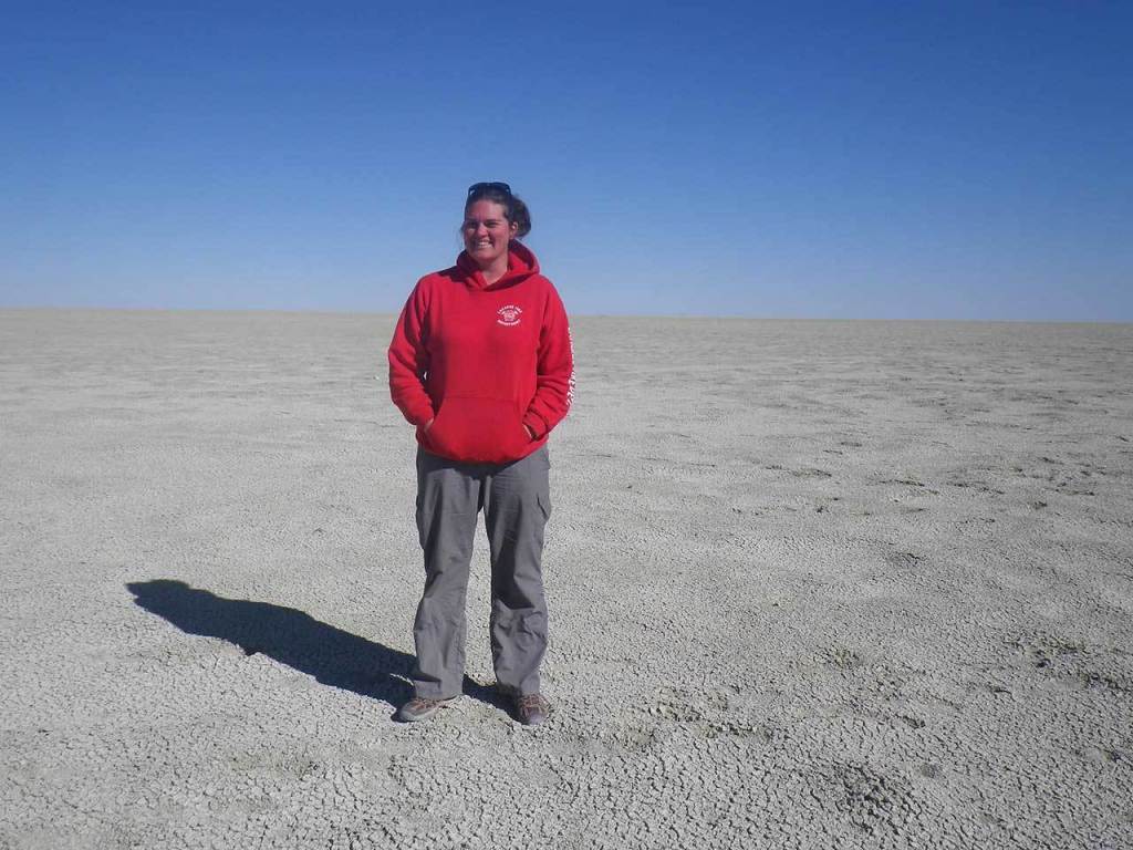 Mary Sarnowski, of Everett, stands in the Salt Pan of Etosha National Park, Namibia. Sarnowski traveled to Namibia in July through Project Dragonfly, a program of Miami University in Oxford, Ohio. (Contributed photo)