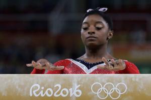 Biles’ run at Olympic history ends with bronze on the beam