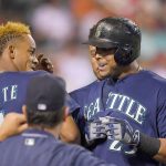 The Mariners&rsquo; Nelson Cruz (right) celebrates with Ketel Marte after hitting a solo home run during the fifth inning. (AP Photo/Mark J. Terrill)