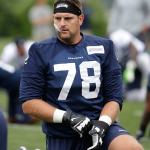 Seahawks tackle Bradley Sowell stretches before a training-camp practice July 30 in Renton. (AP Photo/Elaine Thompson)