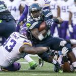 Seahawks running back Christine Michael is tackled by the Vikings&rsquo; Shamar Stephen (left) and Everson Griffen during a preseason game Thursday night at CenturyLink Field in Seattle. (Kevin Clark / The Herald)