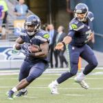 Seahawks running back Christine Michael gets the handoff from quarterback Russell Wilson during a preseason game against the Vikings on Thursday night at CenturyLink Field in Seattle. (Kevin Clark / The Herald)