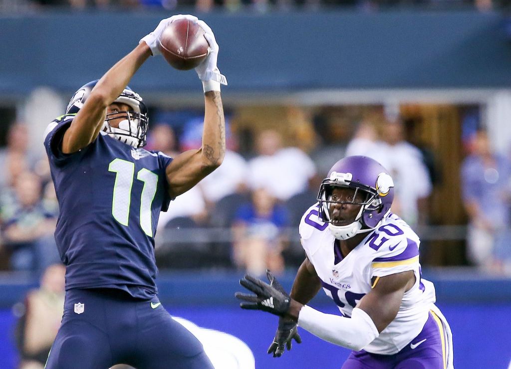 Seahawks wide receiver Kenny Lawler makes a catch with the Vikings&rsquo; Mackensie Alexander defending during a preseason game Thursday night at CenturyLink Field in Seattle. (Kevin Clark / The Herald)