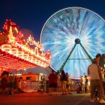 The Giant Wheel lights up the midway as it rotates at the Evergreen State Fair in 2011. (Mark Mulligan / Herald File)