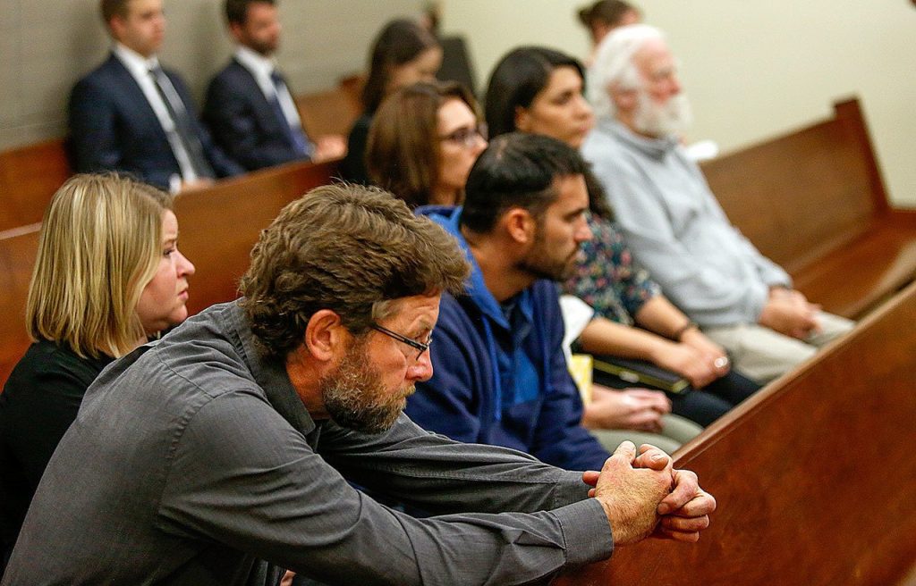 Paul Kramer (foreground) father of victim, Will Kramer, who survived the shooting, is among those attending the arraignment, Monday, of Allen Ivanov, 19, who is accused of gunning down three former Kamiak High School classmates, including his former girlfriend at a house party in Mukilteo on July 30. (Dan Bates/The Herald)