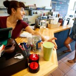 Alive Juice Bar&rsquo;s Leah Flegenheimer (left) serves up a drink at the Ballinger Way shop. (Ian Terry / The Herald)