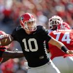 Georgia quarterback Jacob Eason, who played at Lake Stevens High School, is one of three quarterbacks competing for the starting job. The No. 18 Bulldogs open their season Sept. 3 against No. 22 North Carolina, and coach Kirby Smart still hasn&rsquo;t narrowed the competition to two quarterbacks. (AP Photo/John Bazemore, File)