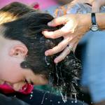 Caden Storm, of Arlington, is cooled off on the first day of the Evergreen State Fair on Thursday afternoon in Monroe. The 12-day fair runs through Labor Day and is one of the largest events held in the Pacific Northwest. (Kevin Clark / The Herald)