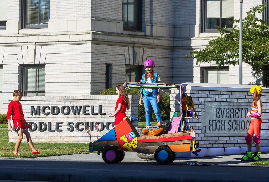 Child actors are filmed from straight out to the left on the street, so Everett High School will appear as McDowell Middle School in the commercial for Fruity Pebbles. (Dan Bates/The Herald)