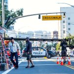 A film crew sets up to film a commercial for Fruity Pebbles in front of Everett High School oon Wednesday. (Dan Bates/The Herald)
