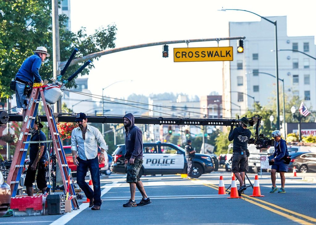 A film crew sets up to film a commercial for Fruity Pebbles in front of Everett High School oon Wednesday. (Dan Bates/The Herald)
