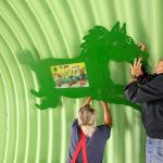 Brothers Rob and Dan O&rsquo;Brien install one of Cheri O&rsquo;Brien&rsquo;s art pieces at the fairgrounds in Monroe.