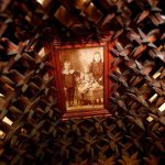 In the museum working space, some items are still in the process of accession. Here, a very old photograph is framed and mounted in a kind of wooden bed of thorns. (Dan Bates / The Herald)