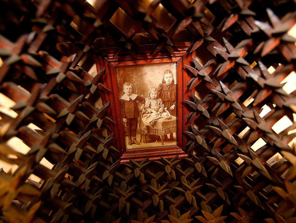 In the museum working space, some items are still in the process of accession. Here, a very old photograph is framed and mounted in a kind of wooden bed of thorns. (Dan Bates / The Herald)