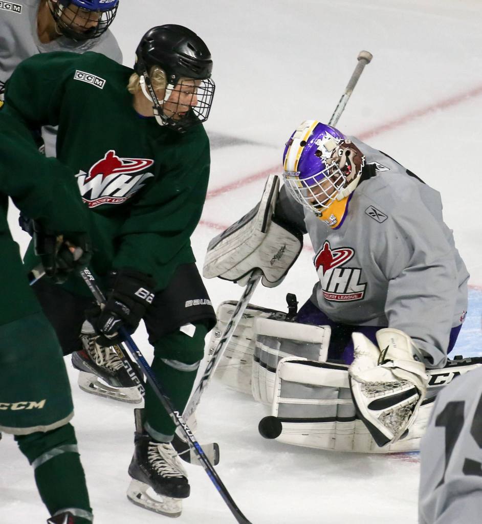Kevin Clark / The Herald                                Orrin Centazzo of Team Green tries to score against Dustin Wolf during the Silvertips&rsquo; annual Green-Grey intrasquad game Sunday at Xfinity Arena in Everett.