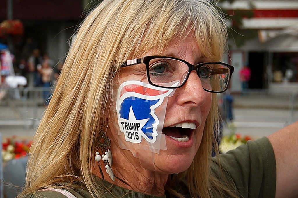 Alma Tramill, of Gig Harbor, makes her way into Xfinity Arena in Everett before a rally for Republican presidential nominee Donald Trump on Tuesday. (Ian Terry / The Herald)