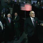 Former New York Mayor Rudi Giuliani and Sen. Jeff Sessions of Alabama (second from left) watch as Donald Trump speaks to supporters at Xfinity Arena on Tuesday in Everett. (Andy Bronson / The Herald)