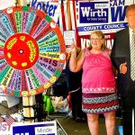 &ldquo;I just like him,&rdquo; says an exuberant Cece Ahles, 69, of Lake Stevens, as she poses for a picture with Trump&rsquo;s cardboard cutout in the GOP booth Monday at the fair. (Dan Bates/The Herald)
