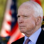 In this Monday, May 30 photo, Sen. John McCain looks on during a Phoenix Memorial Day Ceremony at the National Memorial Cemetery of Arizona in Phoenix. A challenge to the longtime senator leads the lists of contests drawing attention in Tuesday&rsquo;s Arizona primary election. (AP Photo/Ralph Freso, File)