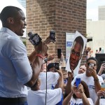 Oklahoma City Thunder guard Russell Westbrook is greets fans as he arrives for a news conference to announce that he has signed a contract extension on Thursday. (AP Photo/Sue Ogrocki)