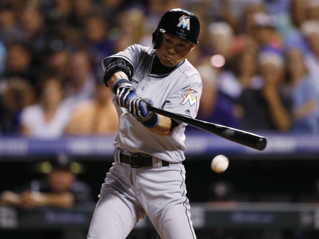 Miami pinch-hitter Ichiro Suzuki records his 2,999th career hit, a single, off Colorado relief pitcher Jordan Lyles in the eighth inning Saturday in Denver. Ichiro grounded out to the mound in his first attempt at No. 3,000. (AP Photo/David Zalubowski)