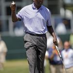 Vijay Singh acknowledges the gallery after making a putt on the 18th hole during first round of the U.S. Senior Open on Thursday at Scioto Country Club in Columbus, Ohio. (Kyle Robertson/The Columbus Dispatch via AP)