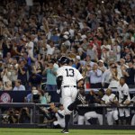 Alex Rodriguez (13) watches his RBI double during the first inning of his last game with the New York Yankees on Friday in New York. (AP Photo/Adam Hunger)