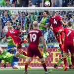 Seattle&rsquo;s Brad Evans heads the ball out of the six-yard box against Real Salt Lake defender Jamison Olave (4) during the second half of the Sounders&rsquo; 2-1 win over Real Salt Lake on Sunday in Seattle. (Lindsay Wasson/The Seattle Times via AP)