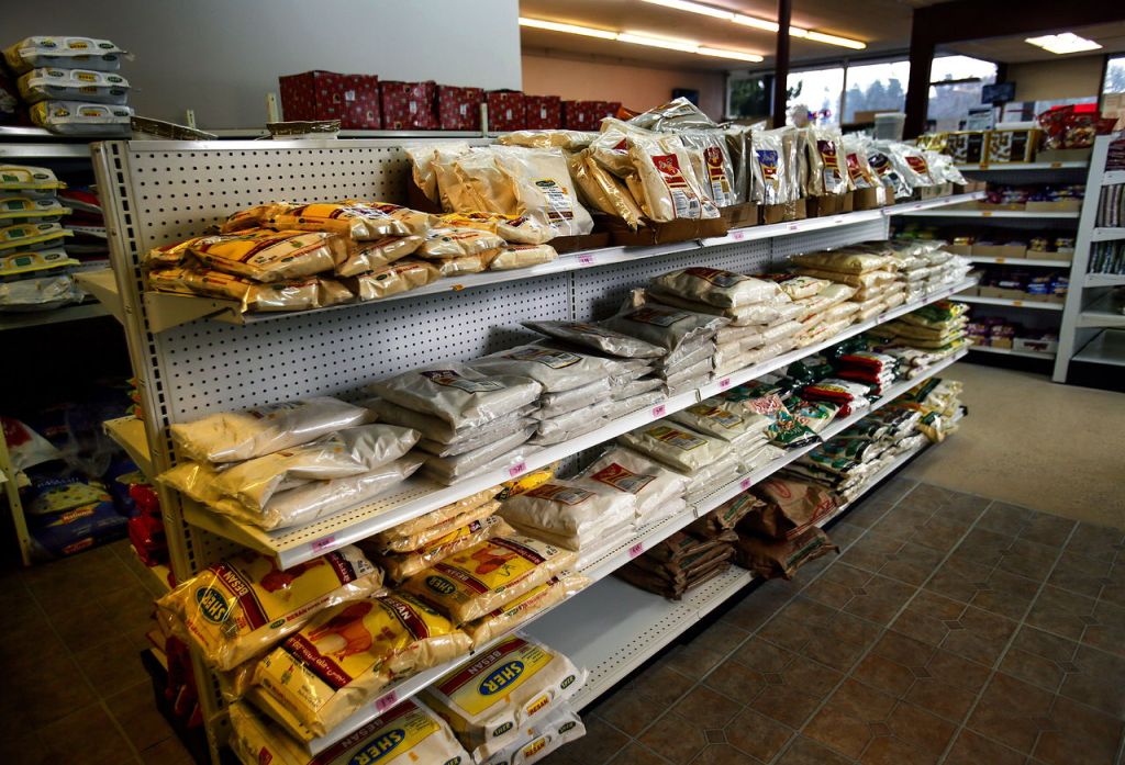 Paradise Market owners, Akbar Quadri and Mohammed Yusuf, keep the shelves well stocked. Toward the back are shelves filled with lentil flour and rice flour.