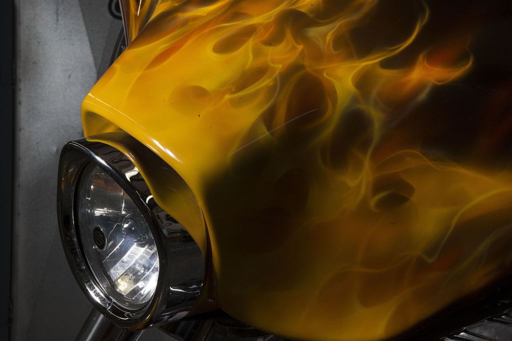 Intricate flames airbrushed by artist Mike Lavallee are seen on a client&rsquo;s Harley-Davidson motorcycle at his studio in Snohomish.