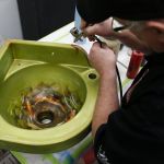 Airbrush artist Mike Lavallee works on a custom corner sink at his studio, Killer Paint, in Snohomish. Lavallee is beginning to focus more on customizing home appliances.