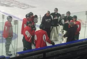 The Silvertips defensemen, clad in red jerseys, listen to their coaches Thursday.