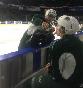 Spencer Gerth gives The Captain some water after practice Thursday.
