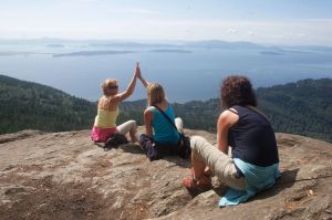 Magdalena Theisen (left) high fives Ewa Klosek after they and Barbara Timofiejuk climbed to the top of Oyster Dome in August 2010. Klosek and Timofiejuk, from Poland, were visiting Thiesen.
