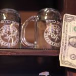 The first dollar Doug Hall and Jeff Sadighi earned decorates their new beer bar in downtown Everett.