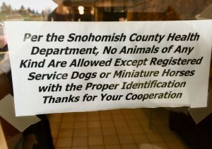 Sign on the door of Village Restaurant & Lounge in Marysville.