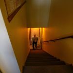 General Manager Tom Clendening starts up the very tricky stairway at KSER on Friday.