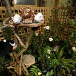 Cat and mouse decorations adorn Fancy Fronds Nursery&rsquo;s New York- and cat-themed booth at the Northwest Flower and Garden Show.