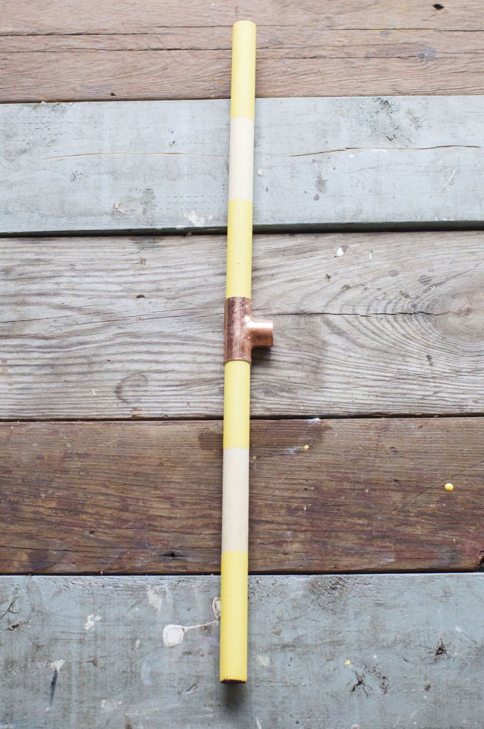 Step 5: Apply glue to another 12-inch dowel, and slide it into the opposing end of the tee. We are building the vertical rails, so the following two steps are all about gaining height.